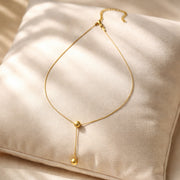 Golden Orb Lariat Necklaces