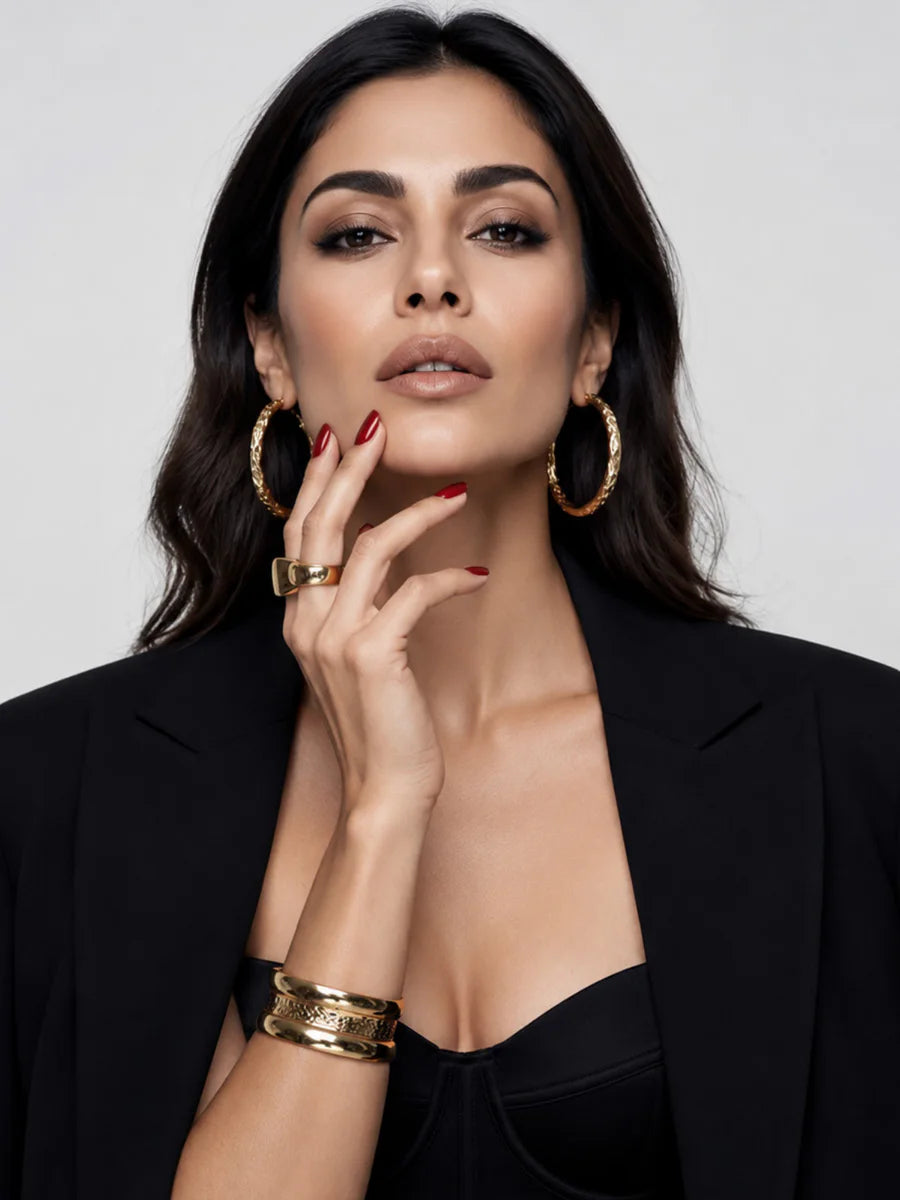 Cool-tone silver jewellery styled with a tailored black look